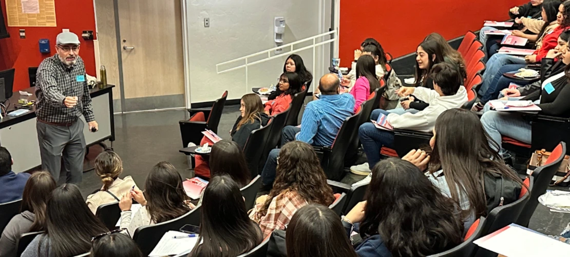 Fuentes talking to students